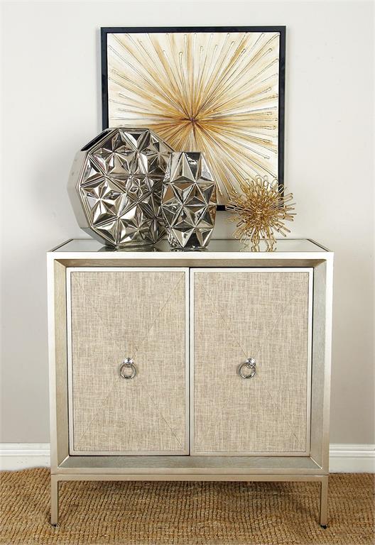 BEIGE WOODEN UPHOLSTERED FRONT PANEL 2 DOOR CABINET WITH MIRRORED TOP AND RING HANDLES